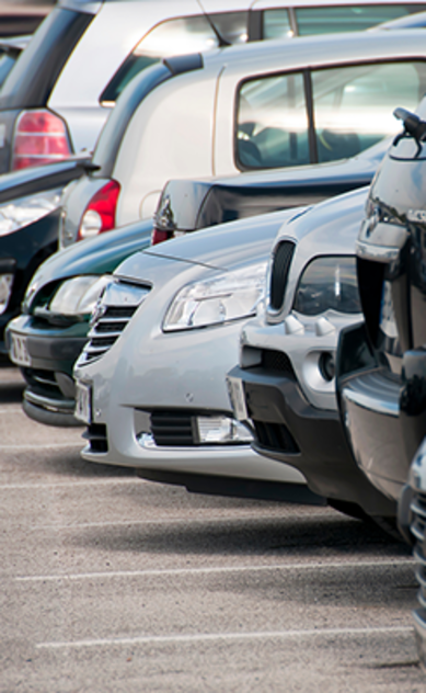 Row of parked cars in a parking lot
